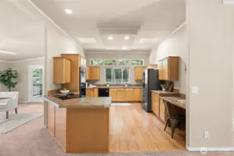 This bright and spacious kitchen is a chef’s delight, featuring double ovens, abundant cabinetry, and expansive counter space.