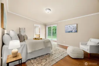 Step into the beautiful primary suite, featuring laminate flooring, a sliding glass door to the backyard, and an inviting connection to the outdoors—perfect for relaxing evenings and maybe even a hot tub in your future.