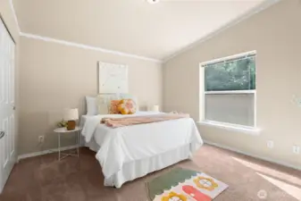 One of two comfortable extra bedrooms, filled with natural light great for bedroom or a home office.