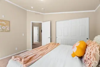 At the end of the hall, you’ll find two generously sized bedrooms—each with double-door sliding closets for easy storage and organization.