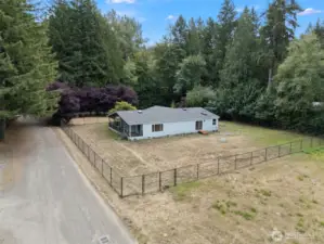 With fencing already in place, this yard is ready for animals of all kinds—whether four-legged friends, feathered flocks, or just space to roam.
