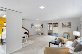 Sliding glass door offers direct access to the backyard and covered porch—perfect for indoor-outdoor flow. The door will need repair or replacement, offering an easy upgrade opportunity.