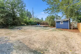 This large, terraced backyard is partially fenced, private, and full of potential—ideal for gardening, play, or entertaining.