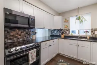 The kitchen has been updated with all new Samsung black stainless steel smart appliances, quartz counters, new soft-close cabinet doors and drawer fronts and hardware.