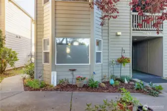 View of the front of the building and the living room windows.