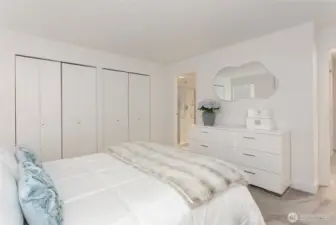 Another view of primary suite noting door to ensuite bath