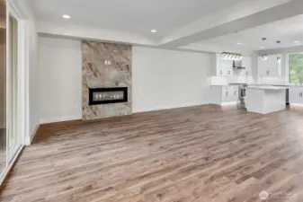 Welcoming living area on main floor with electric fireplace.