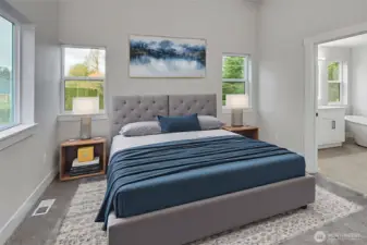 Primary bedroom with vaulted ceilings. Virtually staged.