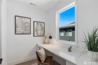 Pocket Office: Dedicated pocket office with large window and built-in desk, ideal for remote work or study. Natural light makes this a comfortable and productive space tucked just off the kitchen.  Staged photos are of the model home of the same floorplan within the Foxmoore community and are for visualization purposes only. Colors, finishes, and layout can and will vary.