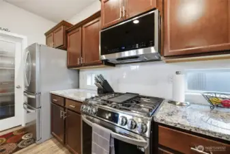 Stainless steel appliances & 5 burner gas range