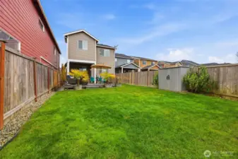 This yard is very private feeling with a covered patio, deck and large, flat yard.