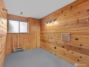 A cedar lined bedroom is a great spot for a home office or craft room.