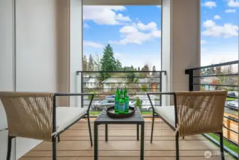 Covered deck off the main level provides a great place for morning coffee.