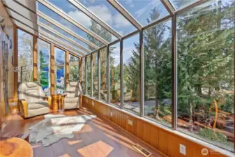 beautiful views from in the Sunroom that has its own mini split for air condition in the summer & shades that pull down to provide shade