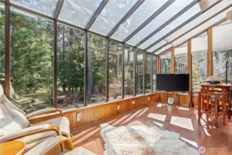 Sunroom overlooks the exquisite landscape