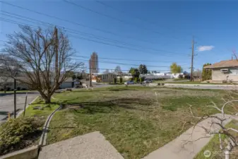 Looking from front steps to street and neighborhood