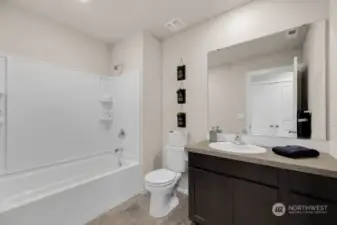 Upstairs hall bath.    Photos are for representational purposes only, colors and features may vary.