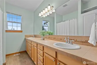 upper guest bath with extensive double vanity