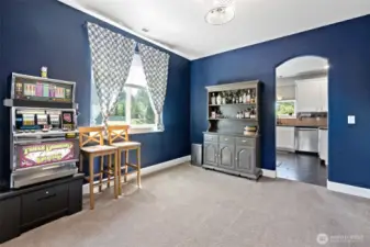 Dining room with archway to kitchen.