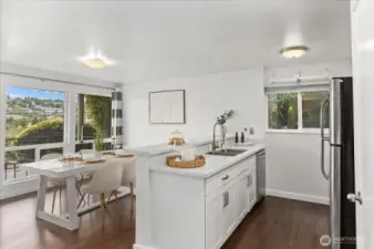 Full dining space beside kitchen.