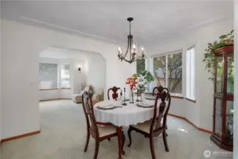 Dining Room with lovely coffered ceiling - large enough for a bigger table if needed.