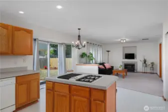 View from Kitchen into Family Room. Plenty of room for a Kitchen table also, with slider out to the back patio - great for summer meals outside or entertaining.