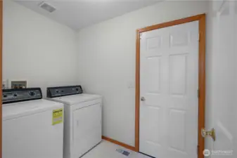 Laundry room with access to garage.