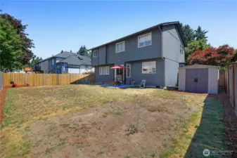 Fully fenced backyard with shed for all your goodies.