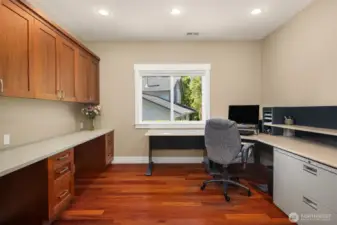 Office with built-in cabinets with views of the lake.