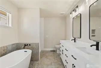 New full bath off primary - new tile, new shower tile, new vanity, new mirrors and all new fixtures!