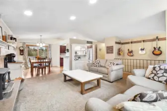 View toward dining, kitchen, deck overlooking spacious backyard