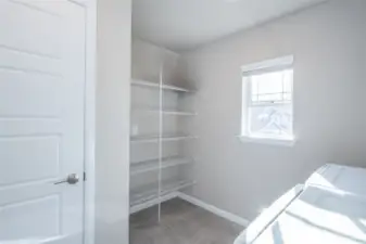 Laundry with storage. Furnace in closet