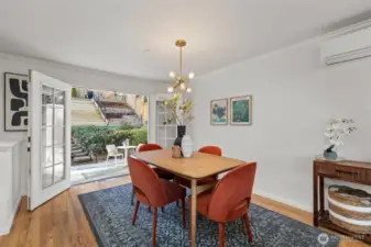 French doors open to a private, fully fenced outdoor sanctuary with easy-care landscaping, an expansive levelled terraced backyard that is perfect for relaxing.