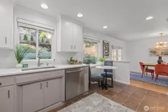 Enjoy terraced backyard views and evening sunsets from the kitchen window.