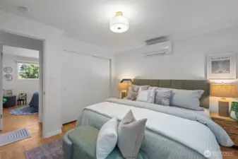 Generously sized primary bedroom easily fits a king-size bed