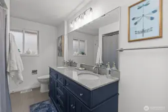 Freshly painted and updated, featuring a spacious double-sink vanity.