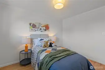 Second bedroom, located directly across from the primary, is perfect for a nursery or kids’ room.