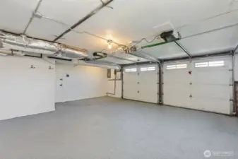 Oversized 2-car garage with extra room for a freezer and storage.