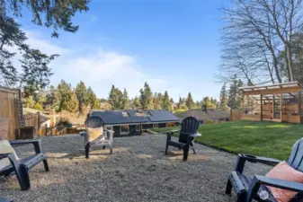 Versatile backyard offers plenty of creative spaces for entertaining, relaxing, and hosting.