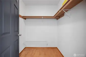 Primary bedroom walk in closet