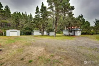 Two Cabins with a laundry area in center & garage (left)