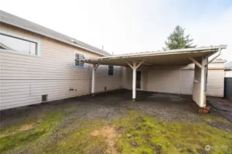 Large driveway with carport and garage