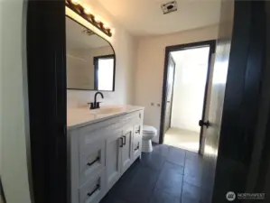 New vanity, fixtures & tile flooring