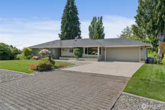 Perfect blend of hardscape elements give this house the wow of curb appeal.