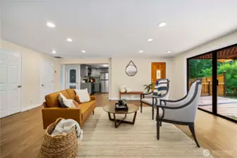 Spacious living room with slider to patio and large fenced backyar