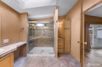 Plenty of natural light and counter space, additional linen storage too!