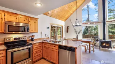 KitchenAid appliances and tile floors finish the kitchen space. You'll enjoy time with friends and family or simply take in the spectacular views through the expansive windows.