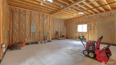 Two car garage with space for a workbench.