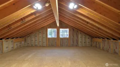 Unfinished space above garage (525 sqft) has roughed-in plumbing for a bathroom and potential for separate living quarters.