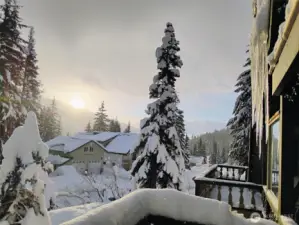 Mountain living in the winter. A view from your neighbors of your newly built garage.